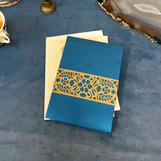 This is a gold vellum wedding invitations by Artifacture called laser cut belly band, ava pattern in antique gold, set of 25 in standard