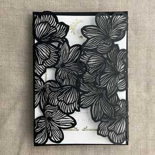 This is a black vellum wedding invitation by Ivory Invitations called Black Orchid Floral Lasercut Gate Jacket for 5x7 inch Invitation | Pack of 10 | Envelopes Included in standard.