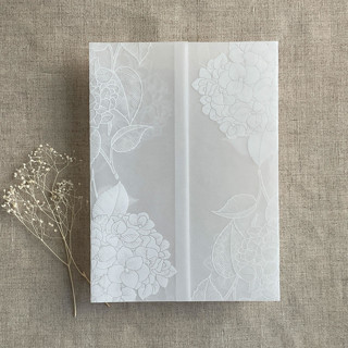 This is a white vellum wedding invitations by Ivory Invitations called white hydrangea floral white ink printed vellum wrap for 5x7 card  | pack of 10 in standard