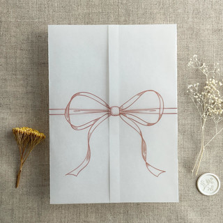 This is a pink vellum wedding invitations by Ivory Invitations called old rose ribbon bow printed vellum wrap for 5x7 card | pack of 10 in standard