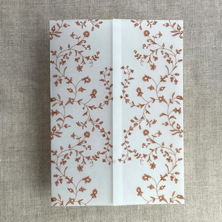 This is a copper vellum wedding invitations by Ivory Invitations called rust dainty floral vines printed vellum wrap for 5x7 card  | pack of 10 in standard