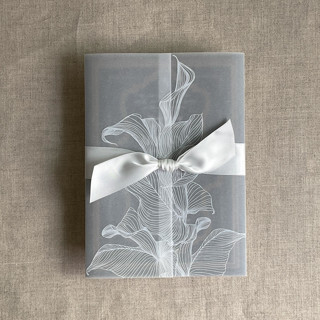 This is a white vellum wedding invitations by Ivory Invitations called white calla floral printed vellum wrap for 5x7 card | pack of 10 in standard
