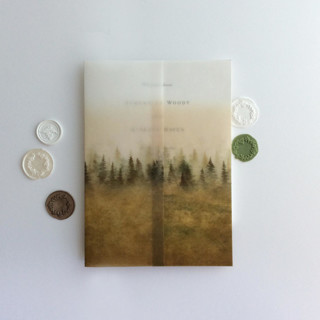 This is a gold vellum wedding invitations by Ivory Invitations called rustic golden ombre forest landscape printed vellum wrap for 5x7 card  | pack of 10 in standard
