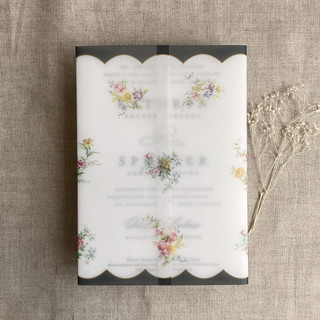 This is a black vellum wedding invitations by Ivory Invitations called clara black scallop floral edge printed vellum wrap for 5x7 card | pack of 10 in standard
