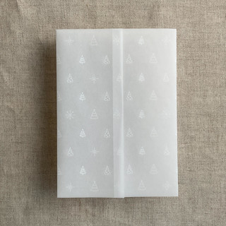 This is a white vellum wedding invitations by Ivory Invitations called white snow flake and forest vellum wrap for 5x7 card | pack of 10 in standard