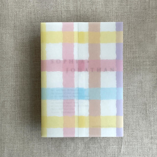 This is a multicolorassorted-colors vellum wedding invitations by Ivory Invitations called marshmallow checkers printed vellum wrap for 5x7 card | pack of 10 in standard