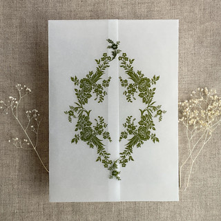 This is a green vellum wedding invitations by Ivory Invitations called moss print french floral crest vellum wrap for 5x7 card | pack of 10 in standard