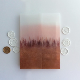 This is a orange vellum wedding invitations by Ivory Invitations called rustic blush rust ombre forest landscape printed vellum wrap for 5x7 card  | pack of 10 in standard