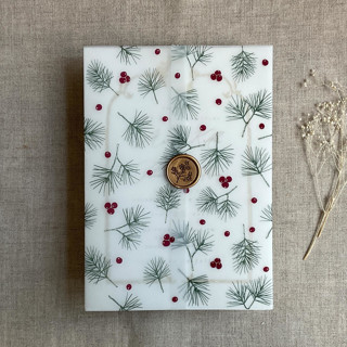 This is a green vellum wedding invitations by Ivory Invitations called holly berries green pine leaves printed vellum wrap for 5x7 card | pack of 10 in standard