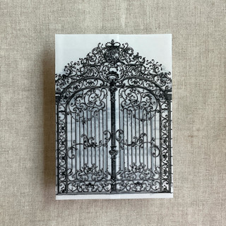 This is a black vellum wedding invitations by Ivory Invitations called black vintage arched gate printed vellum wrap for 5x7 card | pack of 10 in standard