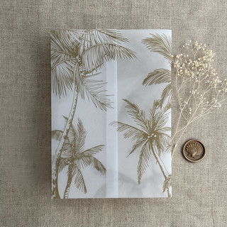 This is a natural vellum wedding invitations by Ivory Invitations called palm trees beach side hazelnut printed vellum wrap for 5x7 card | pack of 10 in standard