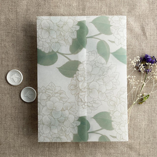 This is a green vellum wedding invitations by Ivory Invitations called antique hydrangea flower sage leaf printed vellum wrap for 5x7 card | pack of 10 in standard
