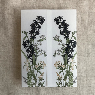 This is a black vellum wedding invitations by Ivory Invitations called eleanor black floral botanic garden printed vellum wrap for 5x7 card | pack of 10 in standard