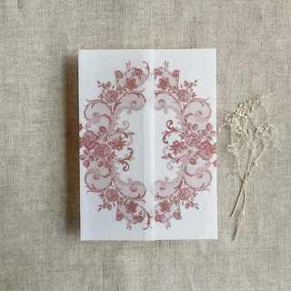 This is a pink vellum wedding invitations by Ivory Invitations called old rose la belle rose lace printed vellum wrap for 5x7 card  | pack of 10 in standard