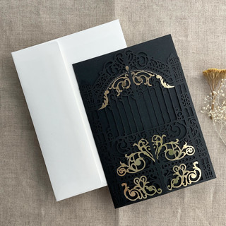 This is a black vellum wedding invitations by Ivory Invitations called black castle gate lasercut jacket for 5x7 inch invitation | pack of 10 | envelopes included in standard