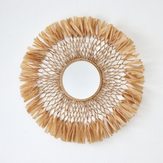 This is a brown accent pieces by Bharti Trivedi called raffia mirror in standard