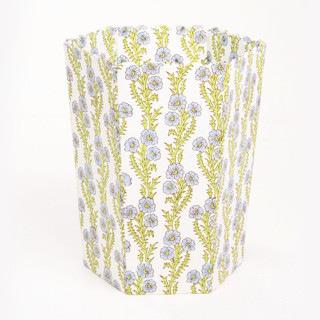 This is a green accent pieces by Michelle Pham called scallop waste bin / storage bin in forget me not blockprint in standard