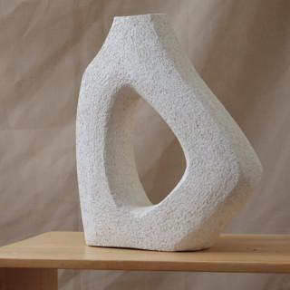 This is a white sculpture art by Virginia Felix called nova sculpture in standard