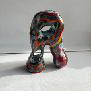 This is a multicolor sculpture art by Nina Leth called standing strong in standard