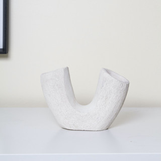This is a white sculpture art by Virginia Felix called lima sculpture in standard