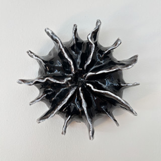 This is a black sculpture art by Nina Leth called black wall hanging in standard