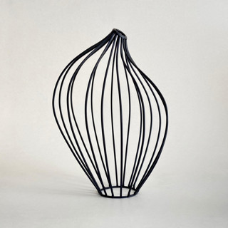 This is a black sculpture art by Emily Meisler called empty vessel in standard