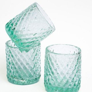 This is a clear tableware by Powered By People called bruma clear glass set of 2 - artisan blown eco-friendly drinkware in standard