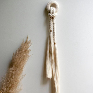 This is a white original textiles by Powered By People called emma petite collection wall hanging in standard