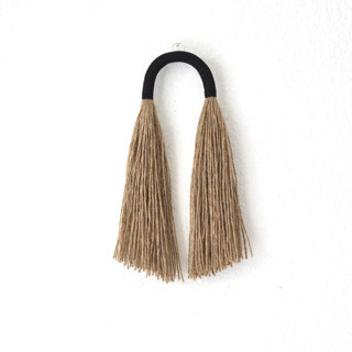 This is a black original textiles by Bharti Trivedi called small jute tassel in standard