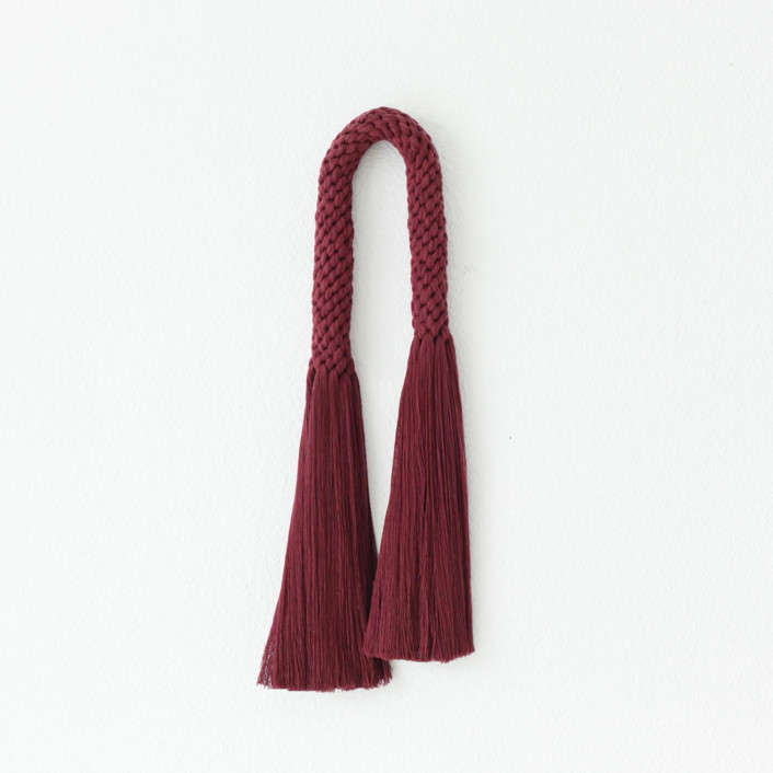Soft natural fiber arch in wine