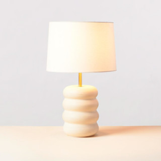 This is a white home decor by Rory Pots called eau lamp in standard