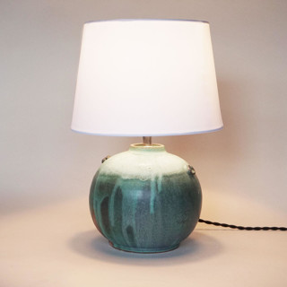 This is a green home decor by Jenny Mulder called olive moon lamp in standard