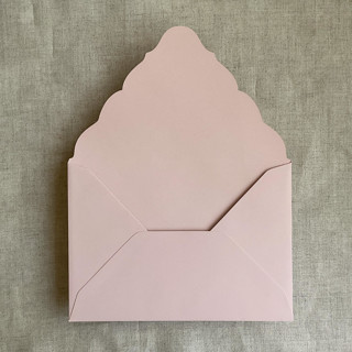 This is a pink wedding envelopes by Ivory Invitations called cipria a7 venetian  flap envelope | pack of 25 in standard