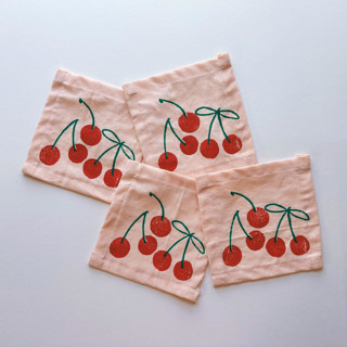 This is a pink tableware by Julie Peach called cherry cocktail napkin set in standard