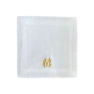 This is a white tableware by Virginia Marcello called monogram cocktail napkins in standard