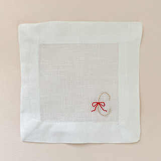 This is a white tableware by Jessica Penley called personalize ribbon letter cocktail napkins - set of 4 in standard