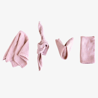 This is a pink tableware by borrowed BLU called organic cotton napkins // set of 4 in standard