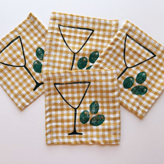 This is a yellow tableware by Julie Peach called martini cocktail napkin set in standard