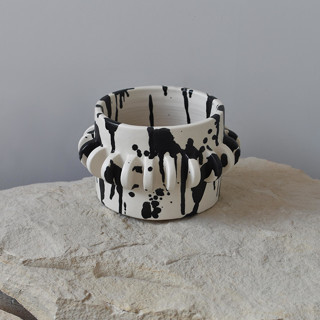 This is a multicolor accent pieces by OWO Cerámica called rock handmade ceramic planter - black & white in standard