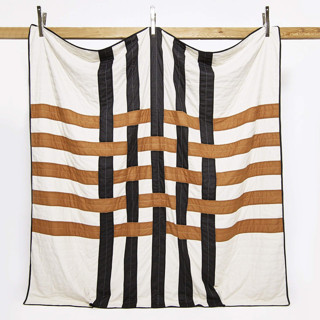 This is a brown direct from artists by Anchal called woven patchwork quilt bedding - queen in standard