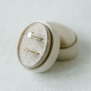 This is a beige wedding accessories by The Heirloom Ring Box called champagne ring box (double slot) in standard