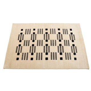 This is a white rugs by Anjali Purohit called varj hand knotted rug in standard