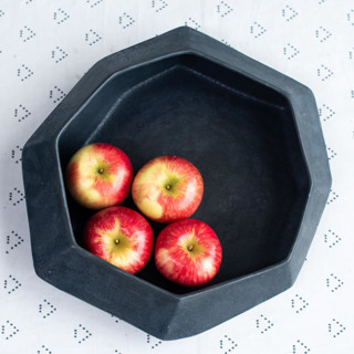 This is a black tableware by Lauren Herzak Bauman called medium stone serving bowl in jet black in standard