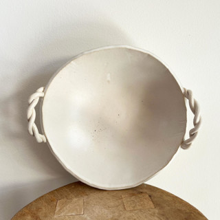 This is a white tableware by Sidney Field called braid handled serving bowl in standard