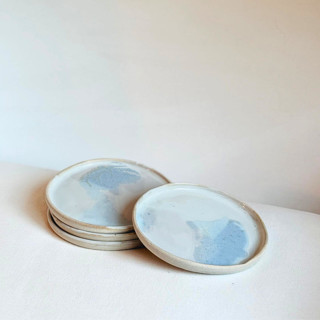 This is a white tableware by Cloude Made called tidal plates - set of 2 in standard