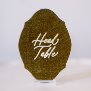 This is a gold wedding signs by Velvet Raptor called head table sign - gold in standard