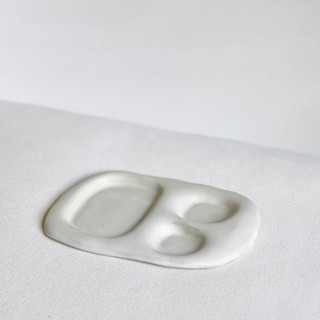 This is a white tableware by Cloude Made called petite snack tray in standard