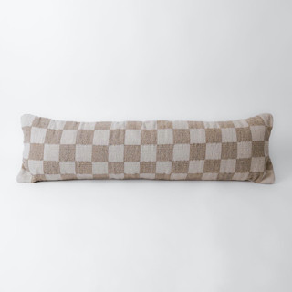 This is a beige throw pillows by Mano Made called sand checkered lumbar pillow in standard