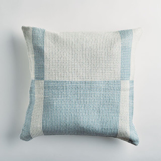 This is a blue throw pillows by Tatiana Ordoñez called paramo cielo blue pillow in standard