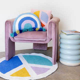 This is a blue throw pillows by Ampersand Design Studio called cool shaped rainbow hook pillow with tassels in standard